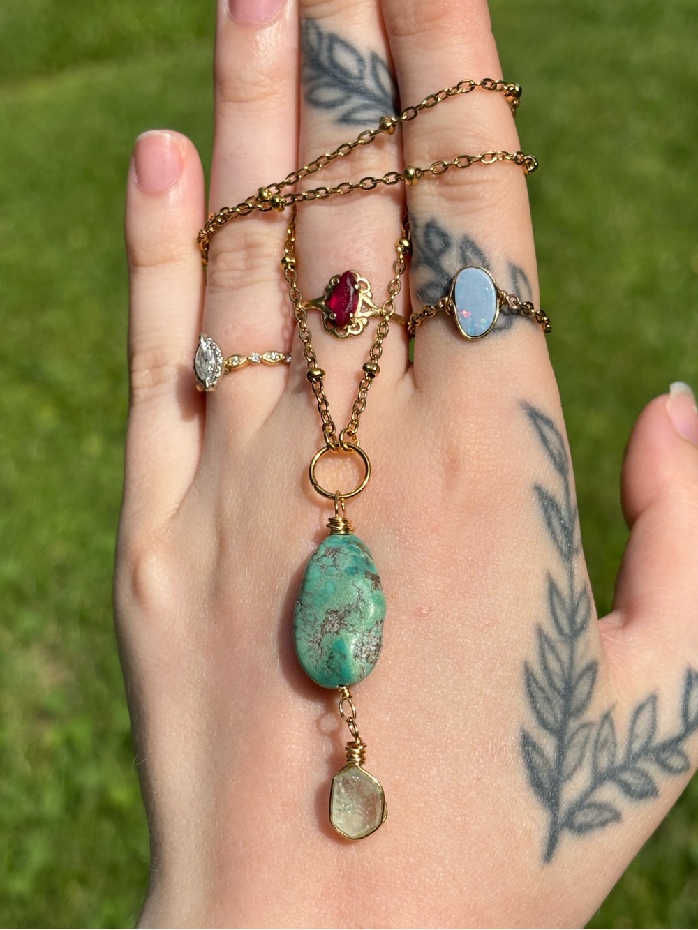 Turquoise and emerald charm necklace